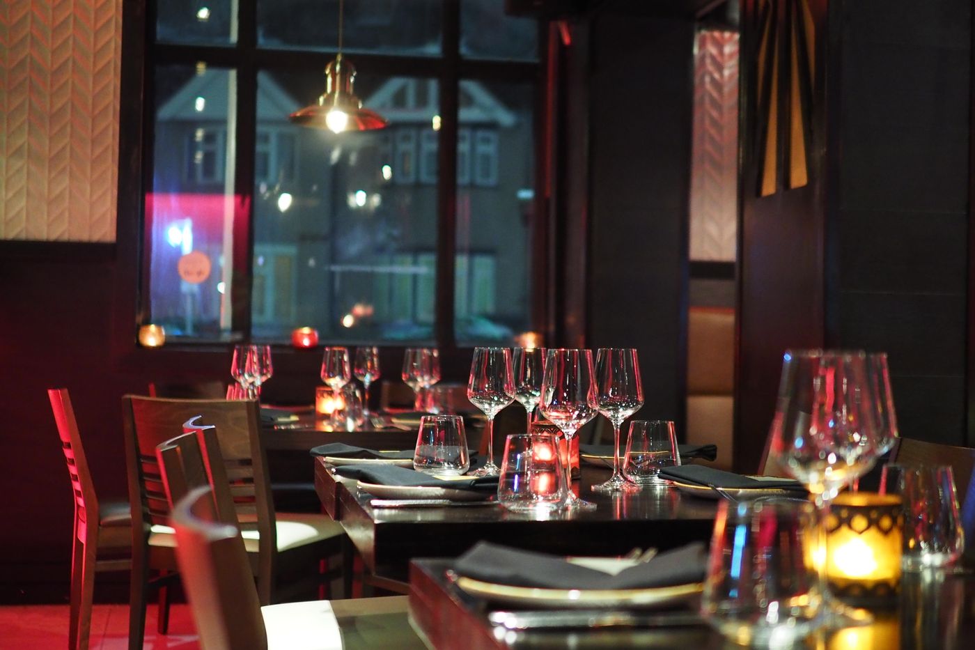 Hospitality dining space with painted walls and pendant lighting