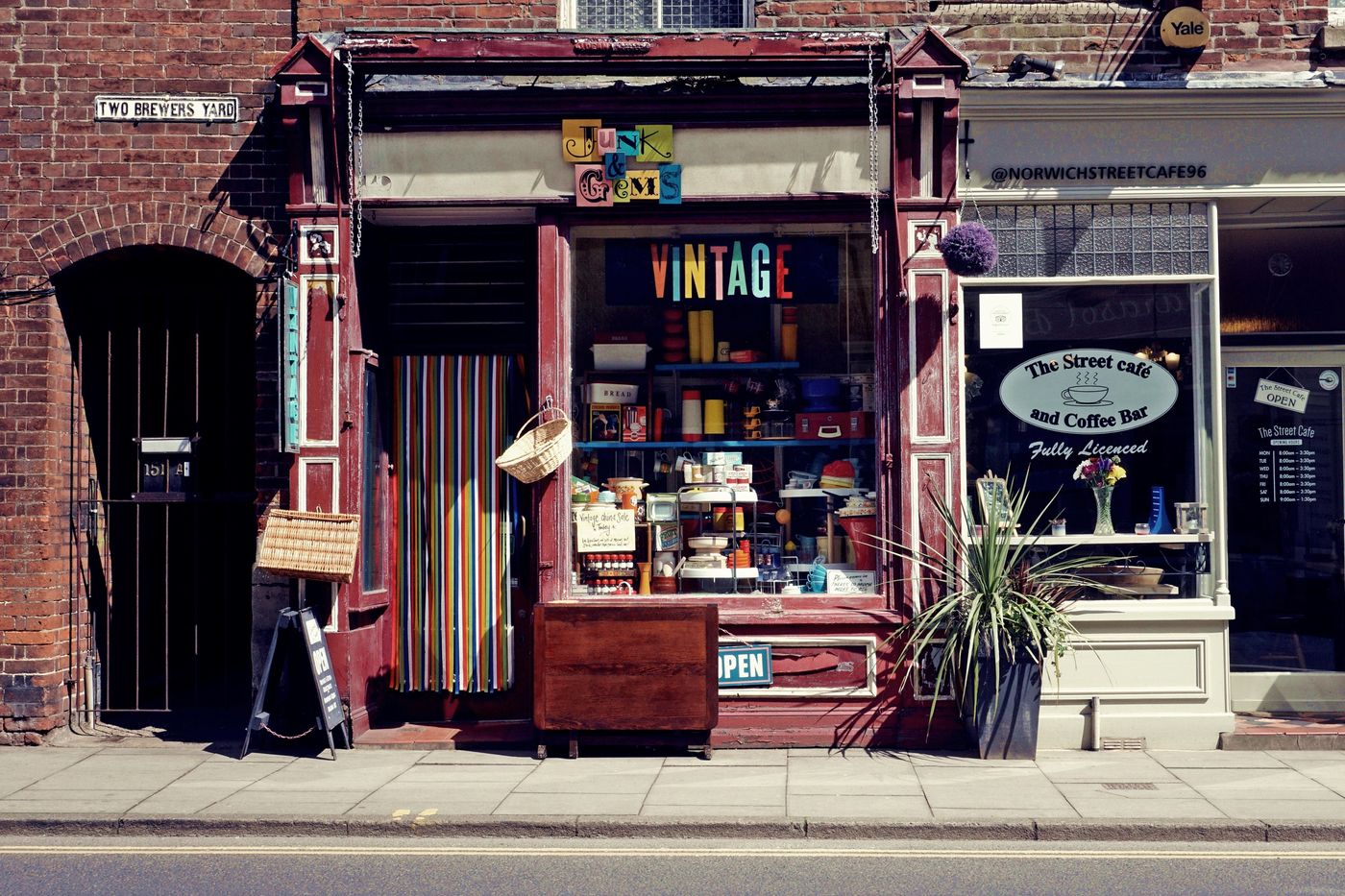Painted shopfront facade and signage on a retail street