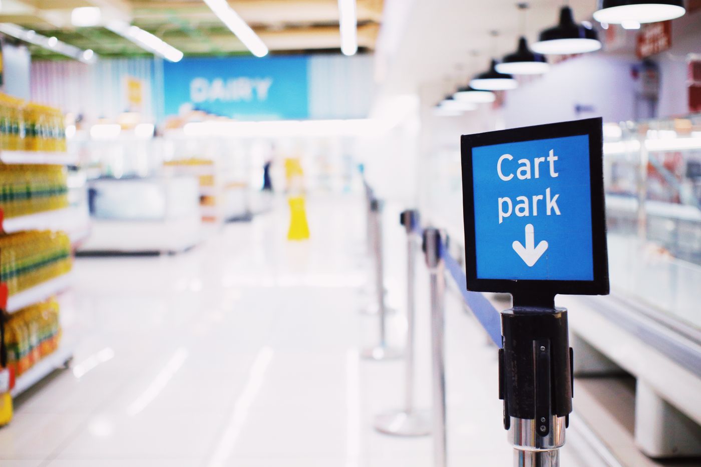 Supermarket aisle with painted ceiling, signage bulkheads and polished floor